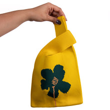 Load image into Gallery viewer, Vibrant yellow knit tote featuring a simple flower design