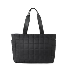 Load image into Gallery viewer, Back of Nollia Emilia black quilted tote bag with smooth puffer finish