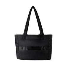 Load image into Gallery viewer, Back view of Nollia Aime black nylon commuter tote with luggage strap.
