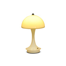 Load image into Gallery viewer, Cordless rechargeable LED table lamp with dimmable settings glowing yellow