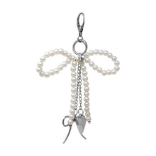 Load image into Gallery viewer, Nollia Pearl Bow Bag Charm – Elegant Beaded Keychain Accessory
