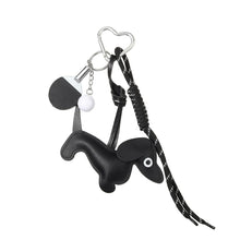 Load image into Gallery viewer, Playful Black Dog Bag Charm with Paddle &amp; Heart Clip
