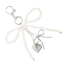 Load image into Gallery viewer, Nollia Pearl Bow Bag Charm – Elegant Beaded Keychain Accessory
