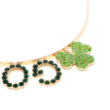 Load image into Gallery viewer, Close-up of shamrock and rhinestone detail on gold tiara headband
