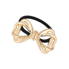 Load image into Gallery viewer, Nollia gold metal bow hair tie on white background
