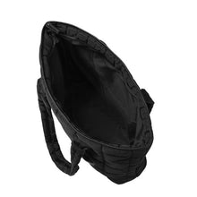 Load image into Gallery viewer, Side profile of black quilted tote bag with padded straps and square stitching.
