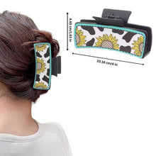 Load image into Gallery viewer, Woman wearing sunflower cow print claw clip in bun
